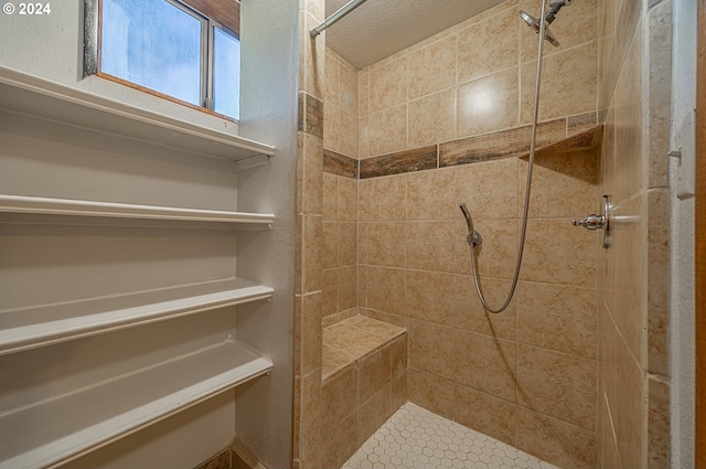 bathroom featuring a tile shower