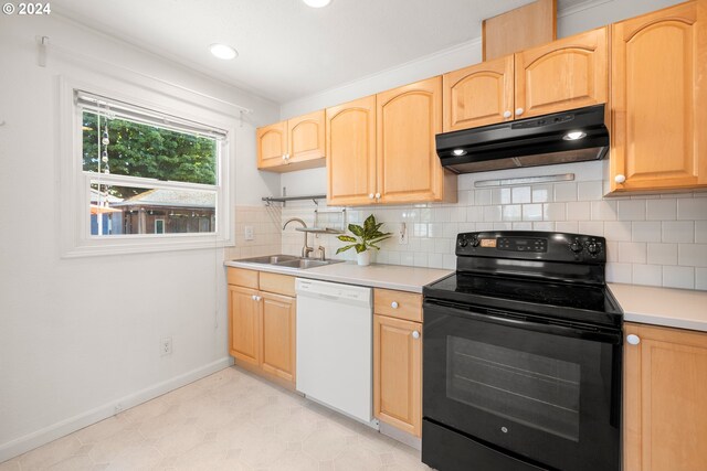 kitchen featuring white dishwasher, sink, electric range, and light brown cabinetry