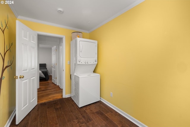 laundry area with crown molding, dark hardwood / wood-style floors, and stacked washer / dryer