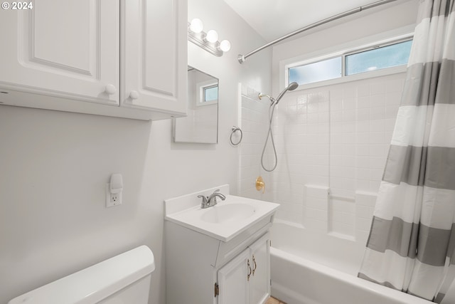 full bathroom with vanity, shower / bath combination with curtain, and toilet