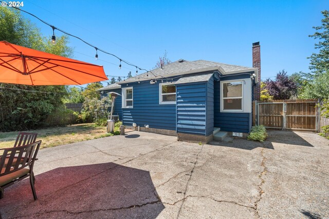 back of house with a patio area