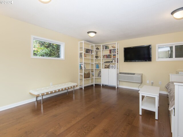 living area with dark hardwood / wood-style floors