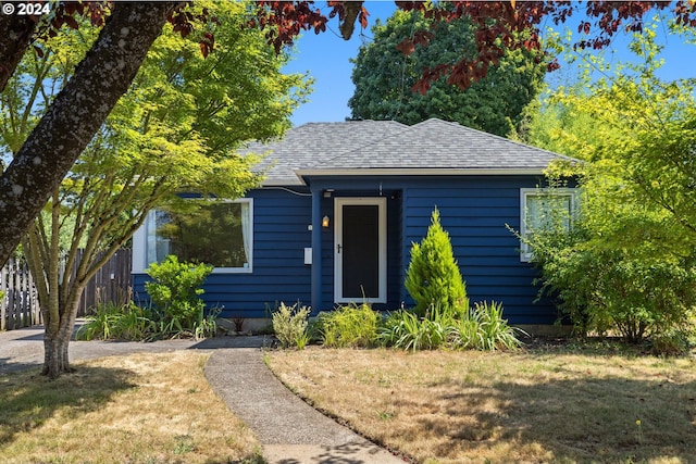 bungalow with a front lawn