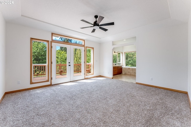 2201 NW Carty Rd, Ridgefield, WA 98642 - spare room featuring carpet, baseboards, french doors, and a ceiling fan