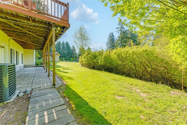 2201 NW Carty Rd, Ridgefield, WA 98642 - view of green lawn featuring a deck and central air condition unit