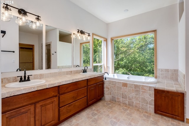 2201 NW Carty Rd, Ridgefield, WA 98642 - bathroom featuring healthy amount of natural light, a garden tub, and double vanity