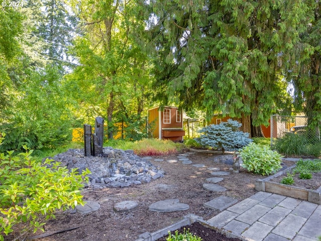 2201 NW Carty Rd, Ridgefield, WA 98642 - view of yard featuring a shed, fence, and an outbuilding
