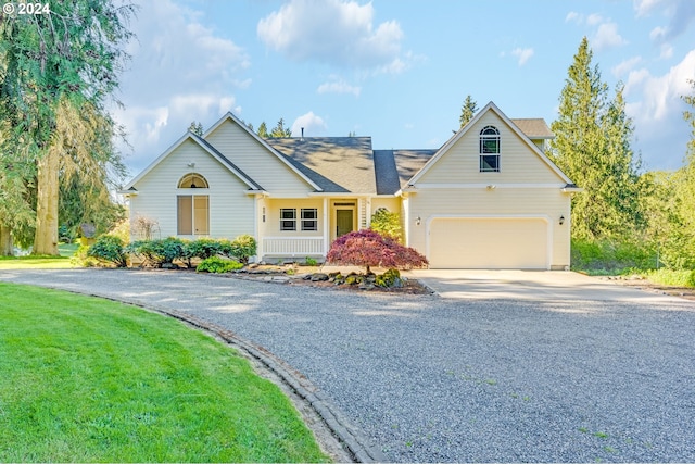 2201 NW Carty Rd, Ridgefield, WA 98642 - view of front facade with driveway, a garage, and a front lawn