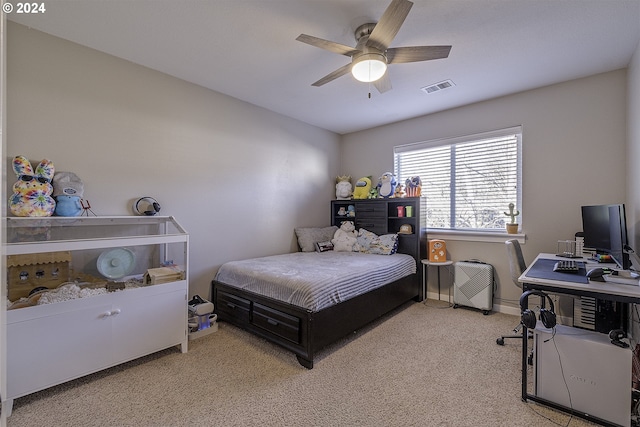 bedroom with visible vents, a ceiling fan, and carpet flooring