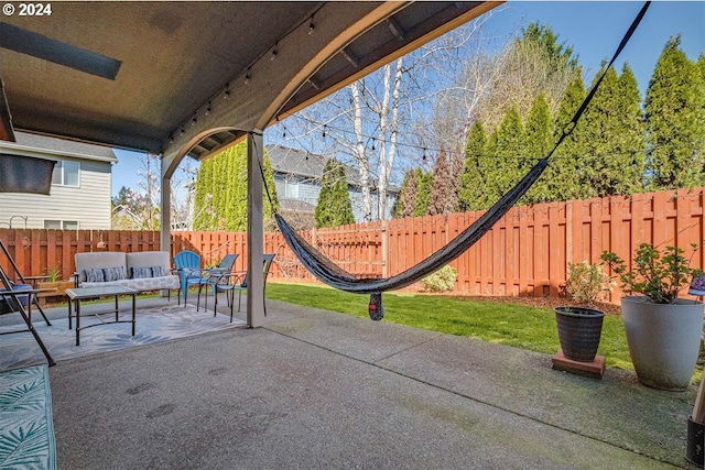 view of patio with an outdoor hangout area and a fenced backyard