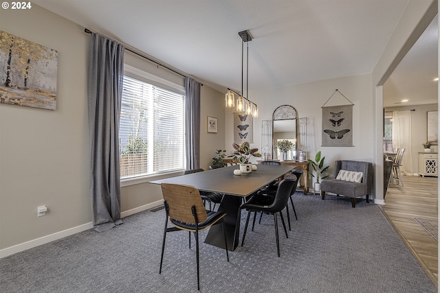 dining space with a chandelier and hardwood / wood-style flooring