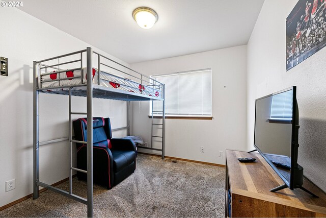 carpeted bedroom with baseboards