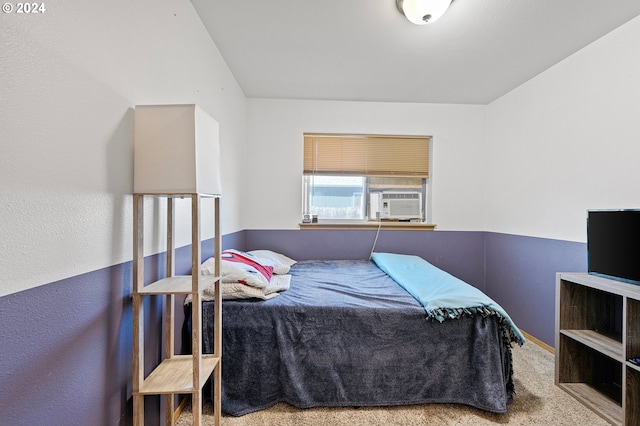 bedroom featuring cooling unit and carpet