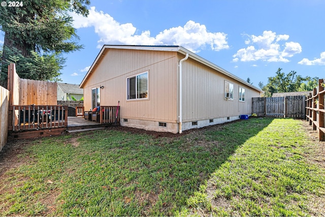 back of house featuring a wooden deck, cooling unit, a fenced backyard, crawl space, and a yard