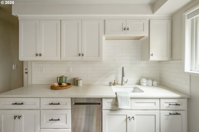 kitchen with white cabinetry, sink, and dishwasher