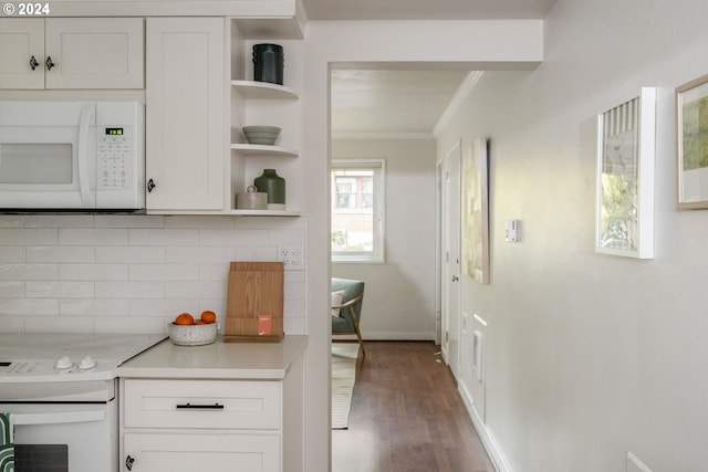 kitchen with dark hardwood / wood-style flooring, decorative backsplash, ornamental molding, white cabinetry, and white appliances