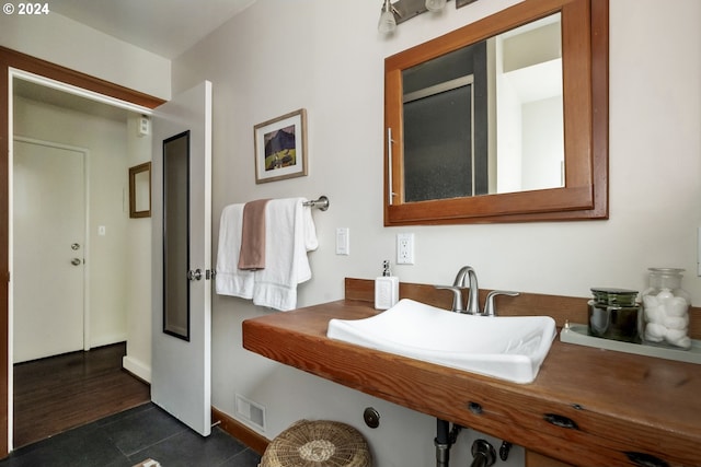 bathroom featuring hardwood / wood-style flooring and sink