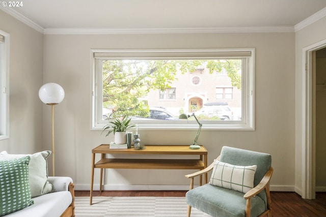 living area featuring dark hardwood / wood-style floors, plenty of natural light, and crown molding