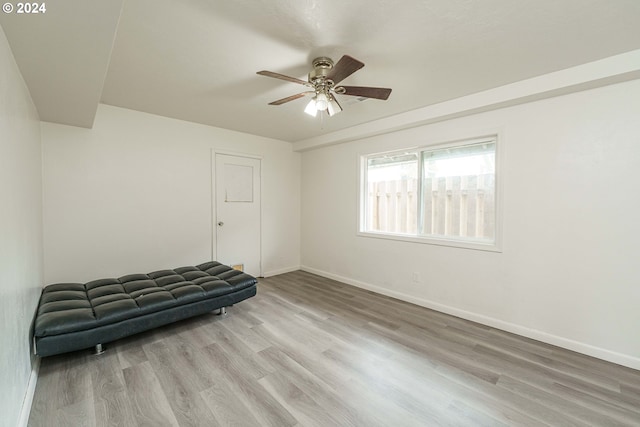 unfurnished room with ceiling fan and light wood-type flooring