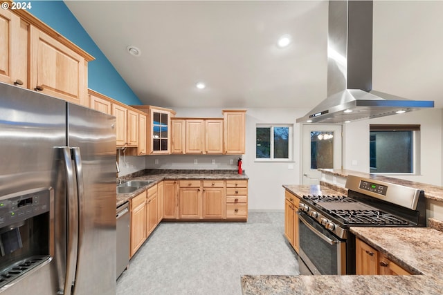 kitchen featuring island range hood, light carpet, stainless steel appliances, lofted ceiling, and light stone counters