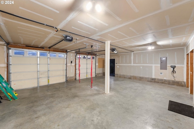 garage featuring a garage door opener and electric panel