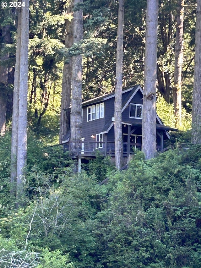 view of side of property with a deck