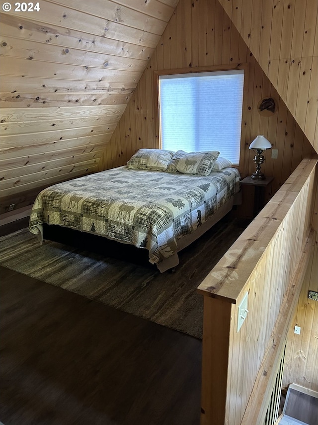 bedroom with wood walls, dark hardwood / wood-style flooring, wooden ceiling, and vaulted ceiling