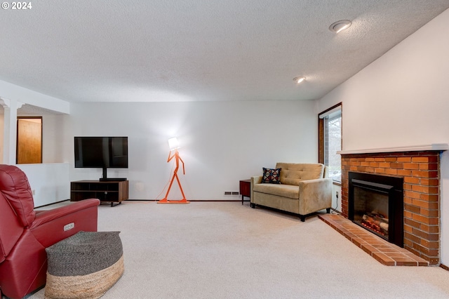 carpeted living room with a textured ceiling and a fireplace