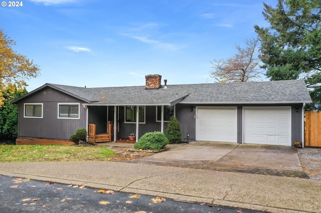 ranch-style house featuring a garage