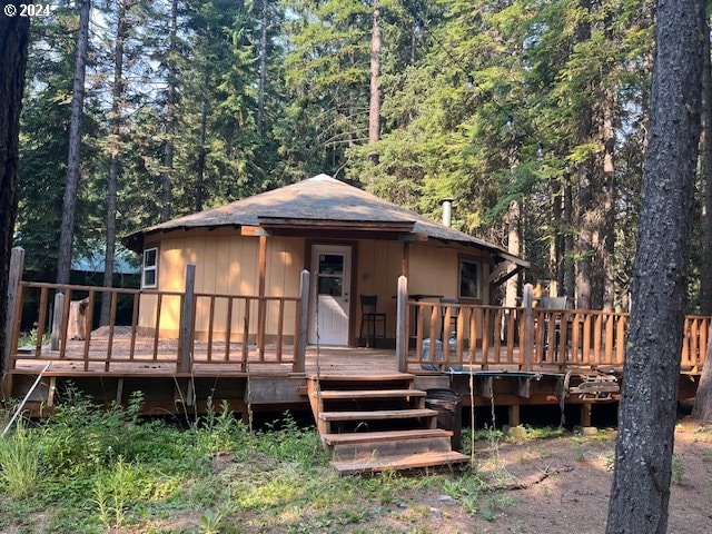 back of house with a wooden deck