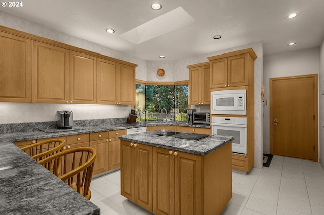 22750 SW Rosedale Rd, Beaverton, OR 97078 - kitchen with a kitchen island, a skylight, white appliances, recessed lighting, and a toaster
