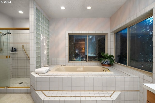 22750 SW Rosedale Rd, Beaverton, OR 97078 - bathroom featuring a bath, a textured ceiling, a stall shower, and vanity