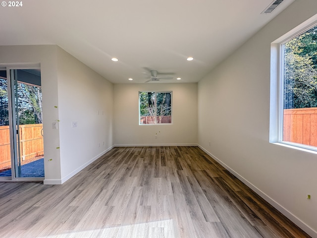 spare room featuring ceiling fan and hardwood / wood-style floors