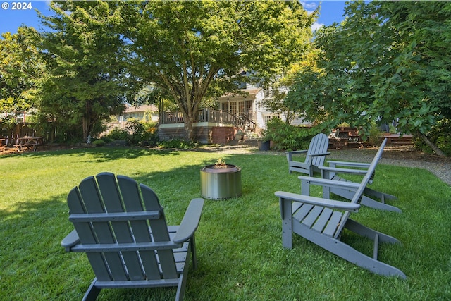 view of yard featuring an outdoor fire pit