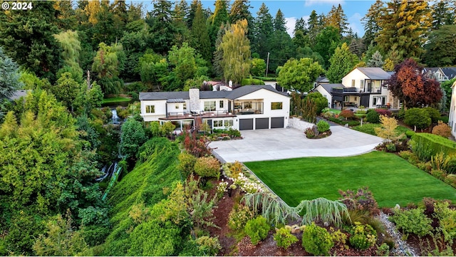 exterior space with a yard and a garage