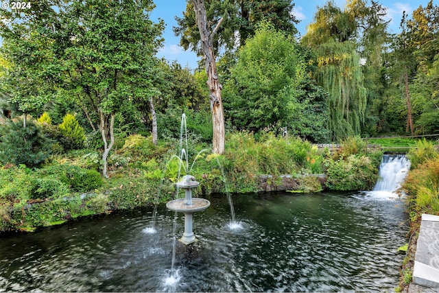 surrounding community featuring a water view