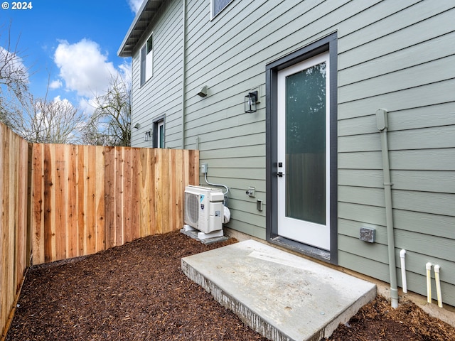 view of exterior entry featuring ac unit