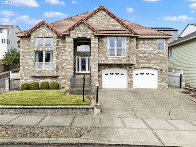 view of front of property with brick siding, driveway, a tiled roof, and fence