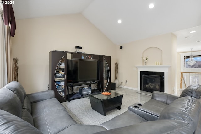 living room featuring light tile patterned floors and vaulted ceiling