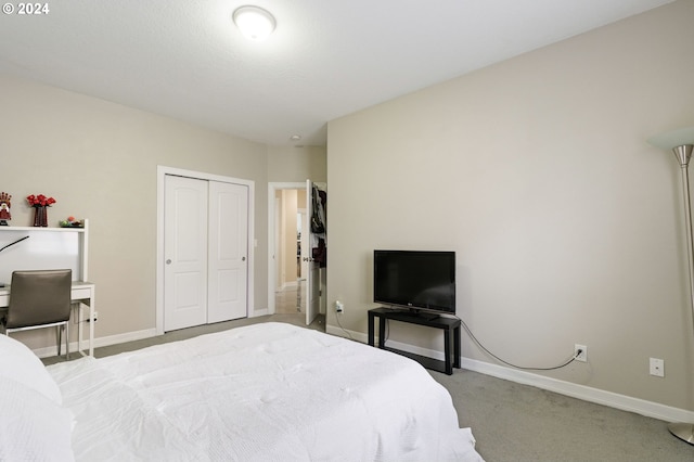 carpeted bedroom featuring a closet