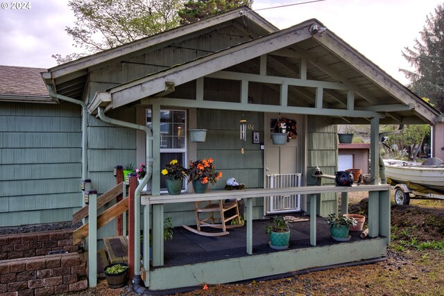 view of outbuilding featuring a porch