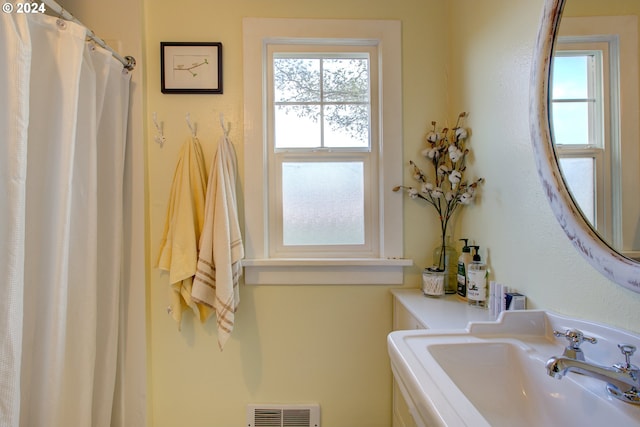 bathroom featuring sink and a wealth of natural light