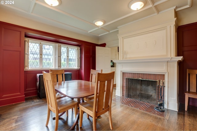 1709 NW Aspen Ave, Portland, OR 97210 - dining room with a fireplace, ornamental molding, wood finished floors, and a decorative wall
