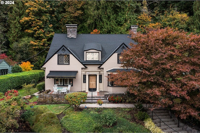 1709 NW Aspen Ave, Portland, OR 97210 - view of front of home with a chimney and stucco siding
