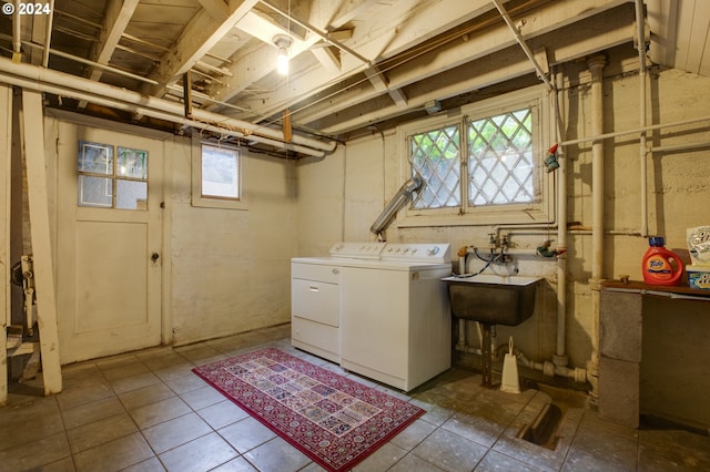 1709 NW Aspen Ave, Portland, OR 97210 - clothes washing area featuring separate washer and dryer, laundry area, a sink, and tile patterned flooring