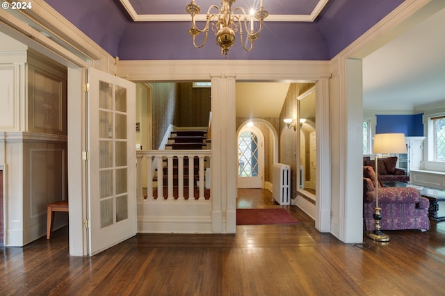 1709 NW Aspen Ave, Portland, OR 97210 - entryway featuring crown molding, radiator, hardwood / wood-style floors, and stairway
