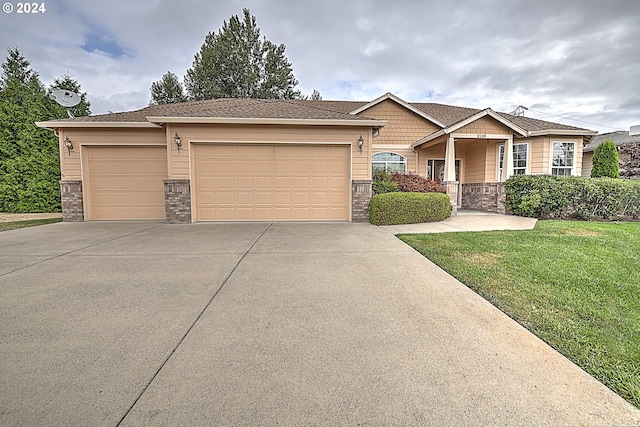 view of front facade with a front lawn and a garage