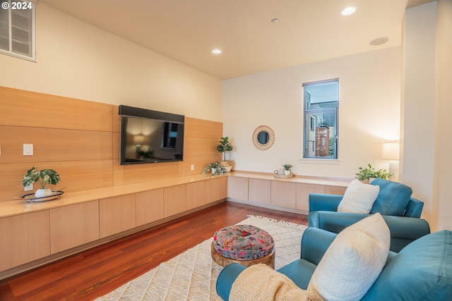 living room with dark hardwood / wood-style flooring