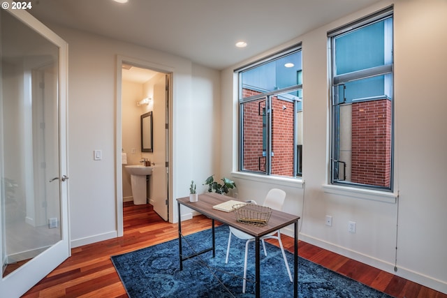 office space featuring wood finished floors, baseboards, and recessed lighting