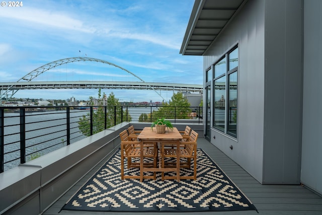 balcony featuring a water view